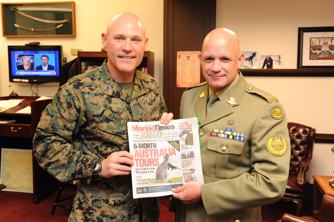 Sgt. Maj. Micheal P. Barrett, the 17th Sergeant Major of the Marine Corps, visits with Warrant Officer David Ashley, the Regimental Sergeant Major of the Australian Army, at the Pentagon in Washington, D.C., Feb. 9, 2012.::r::::n::